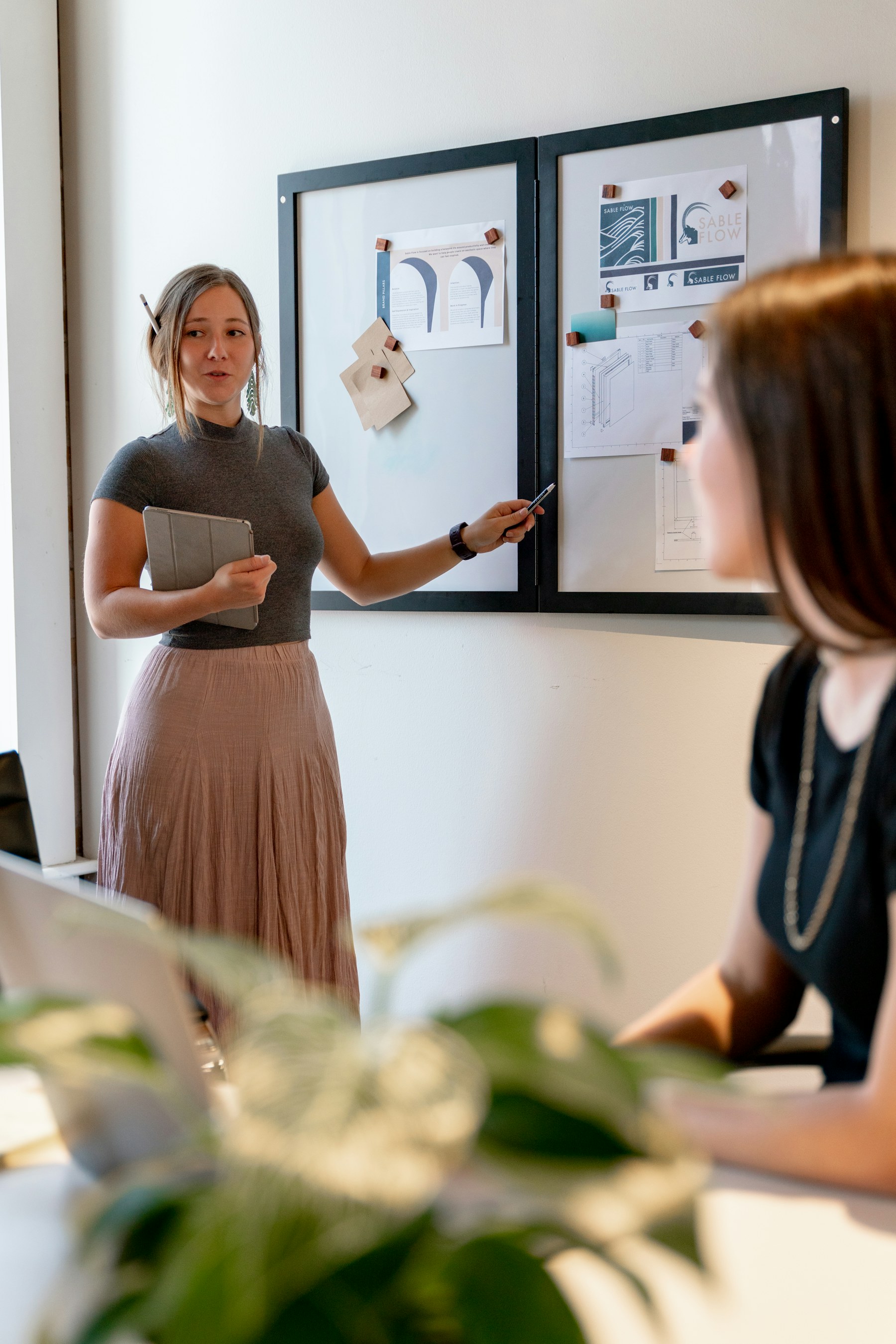 A woman leading a presentation with colleagues